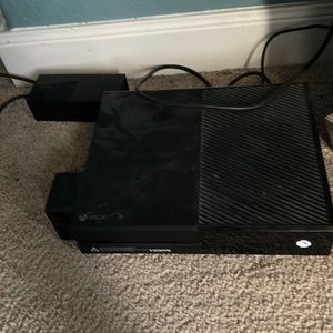 Xbox one console and cyan and grey controller